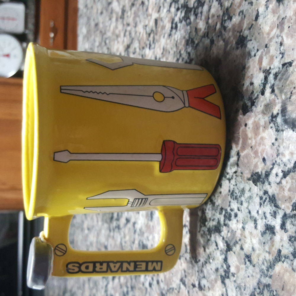 New yellow Menards carpteners mug/ cup with tools on it